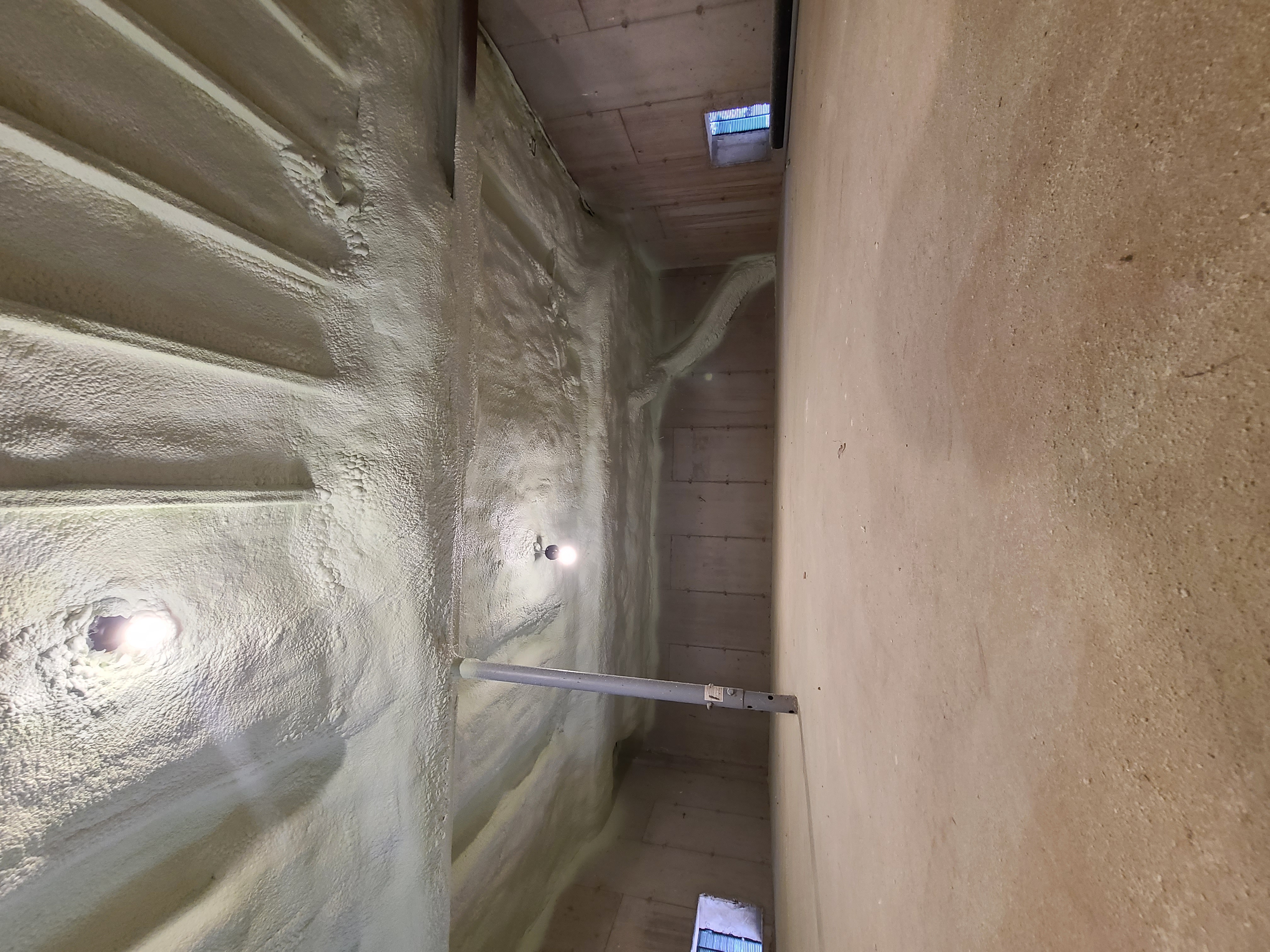 Spray foam applied to crawl space ceiling