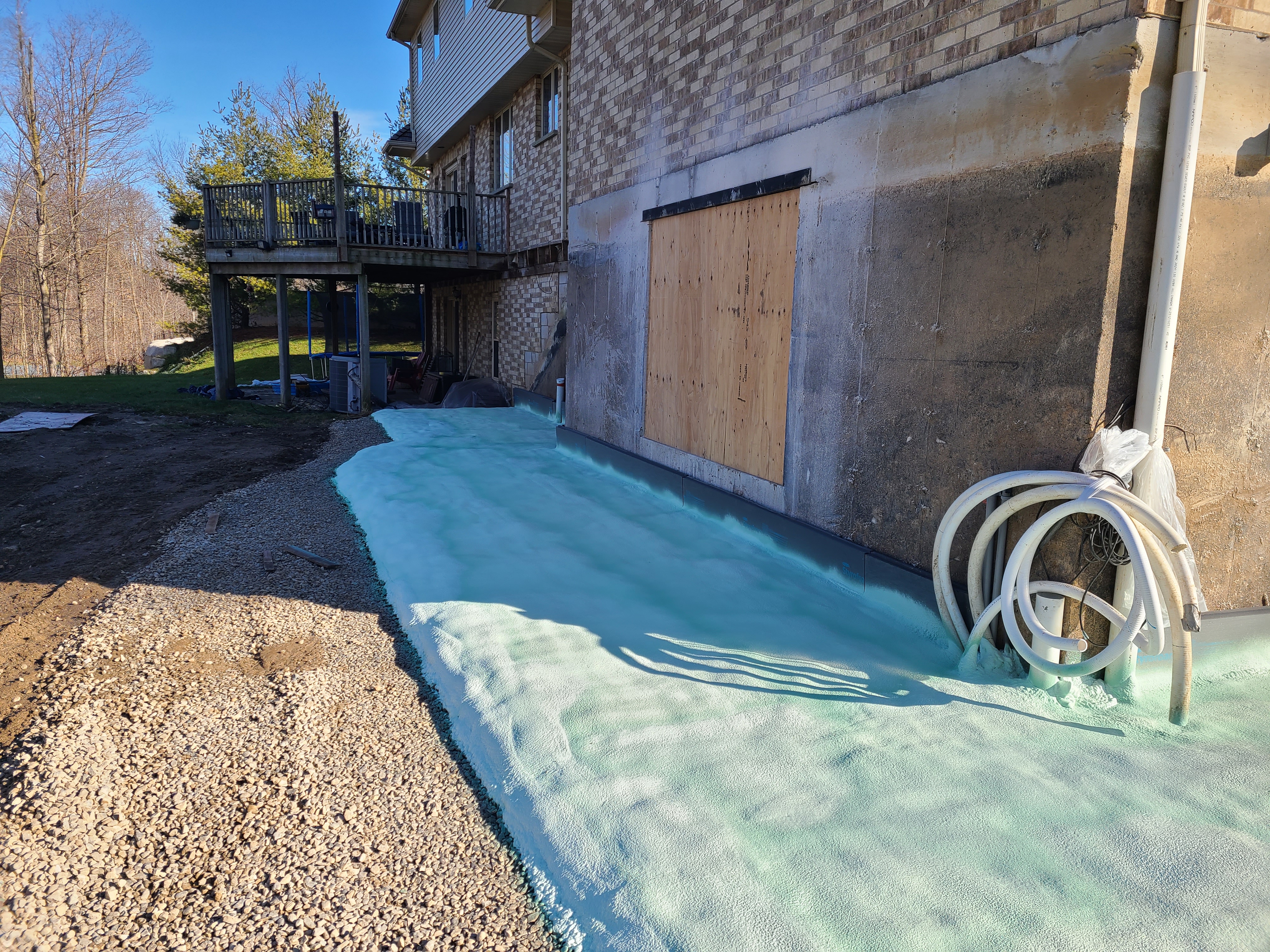 Spray foam applied to exterior foundation